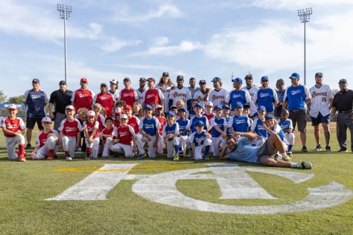 Recreation baseball teams gathered together on a ball field