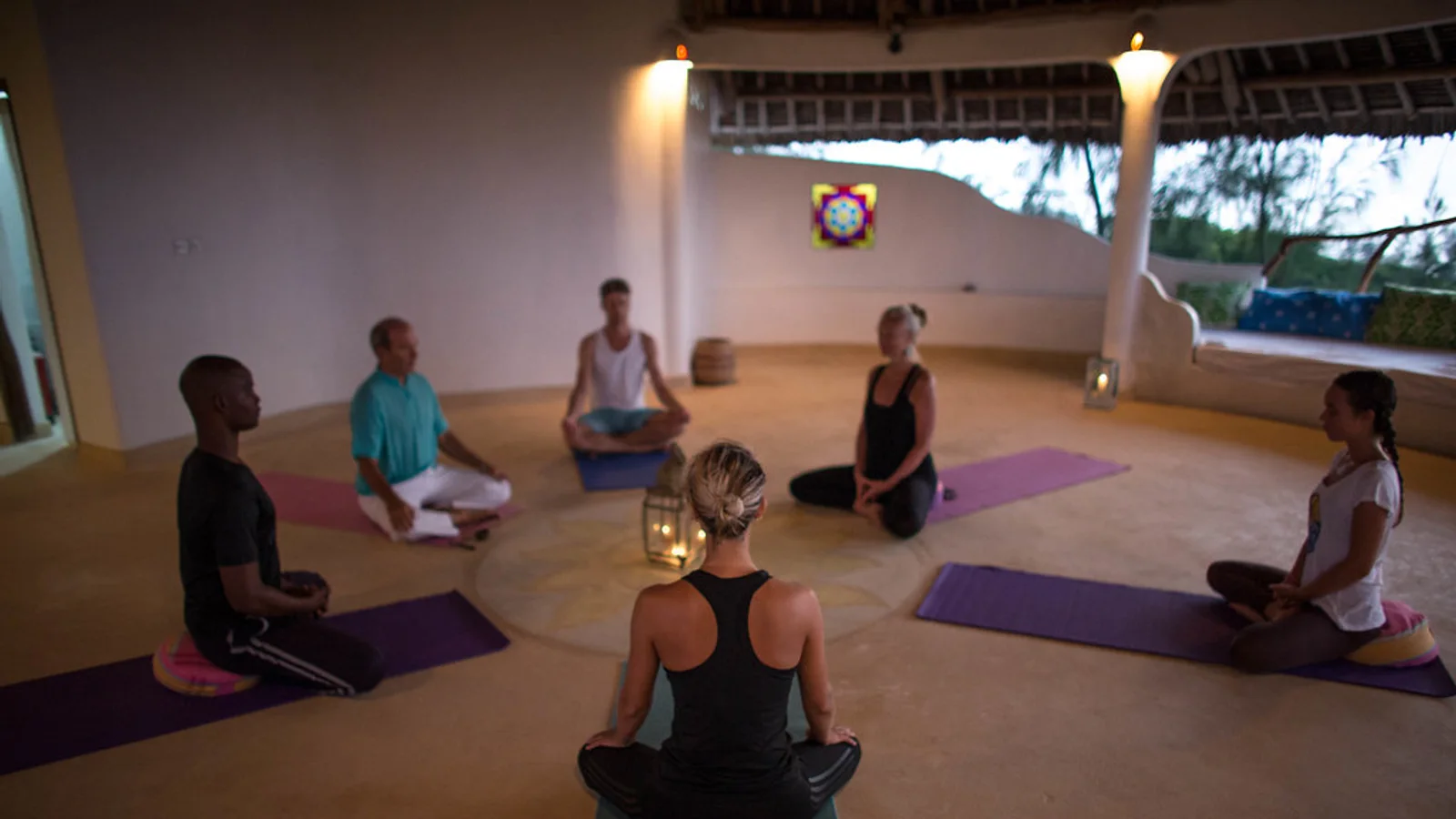 A small group taking part in a guided wellness and mindfulness session