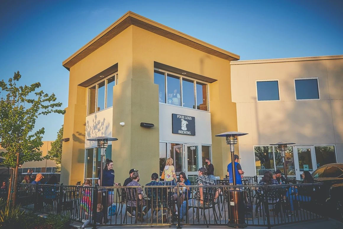 Guests gathered on the outdoor patio at Four Legs Brewing in Brentwood