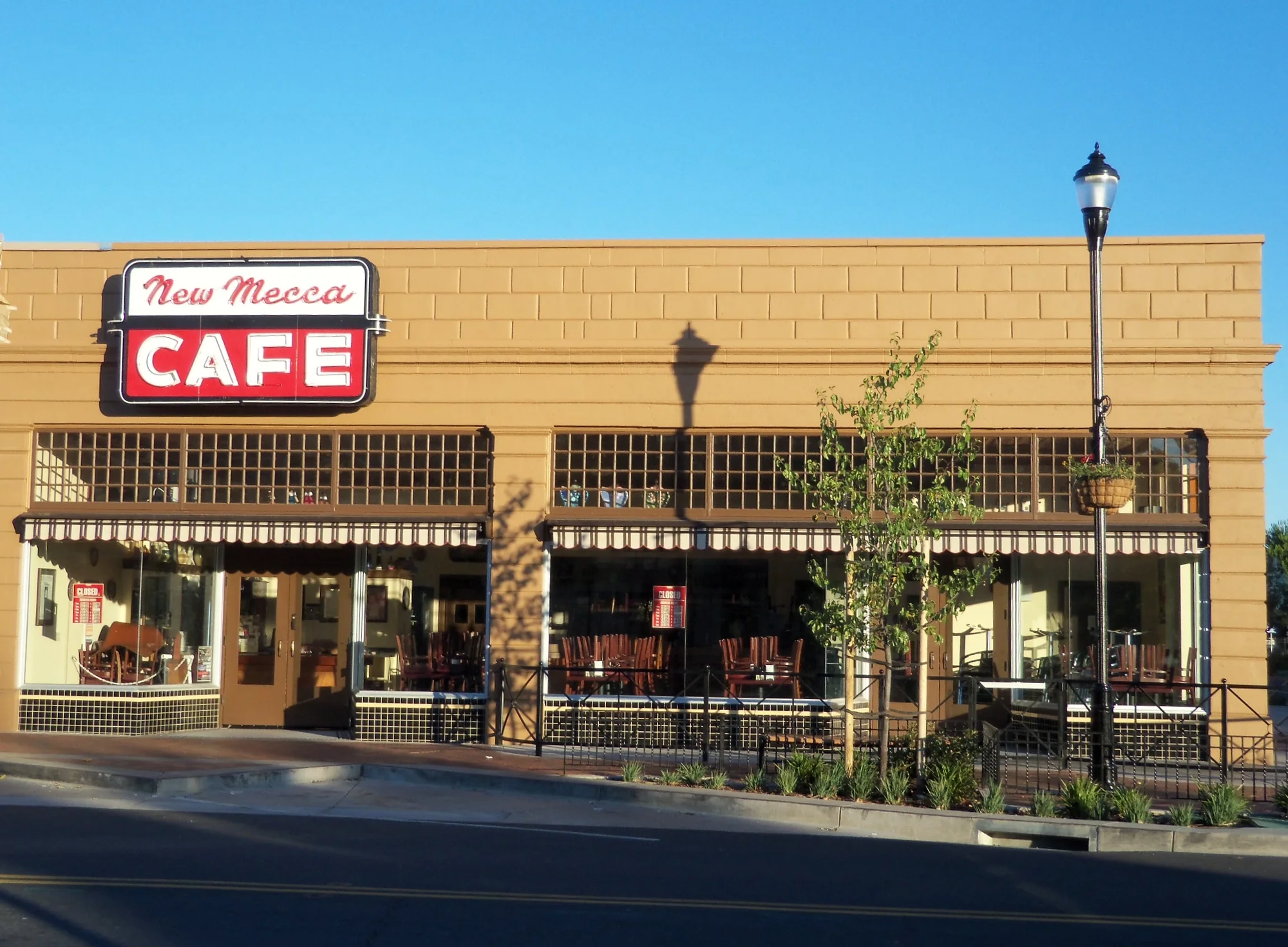 Exterior storefront of New Mecca Cafe on Railroad Avenue in Pittsburg
