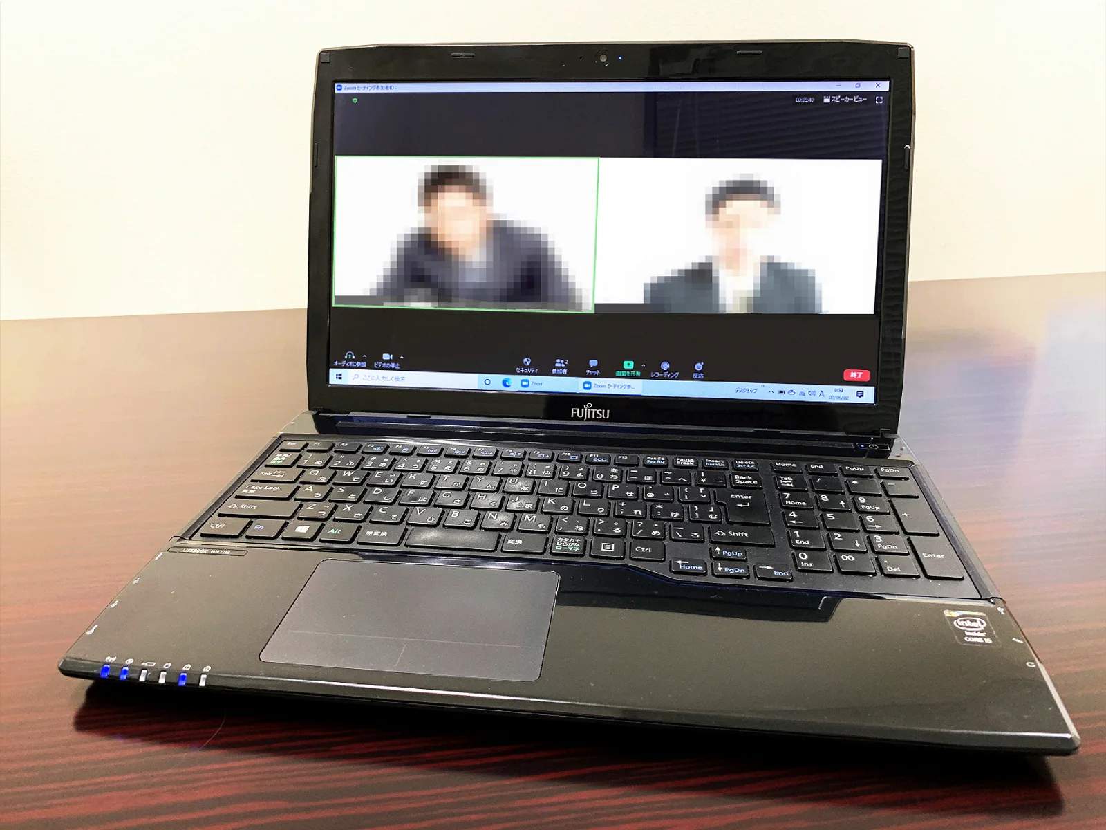 A video conference displayed on a laptop